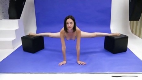 Slender Russian teen Galina Markova does the splits and shows bald pussy